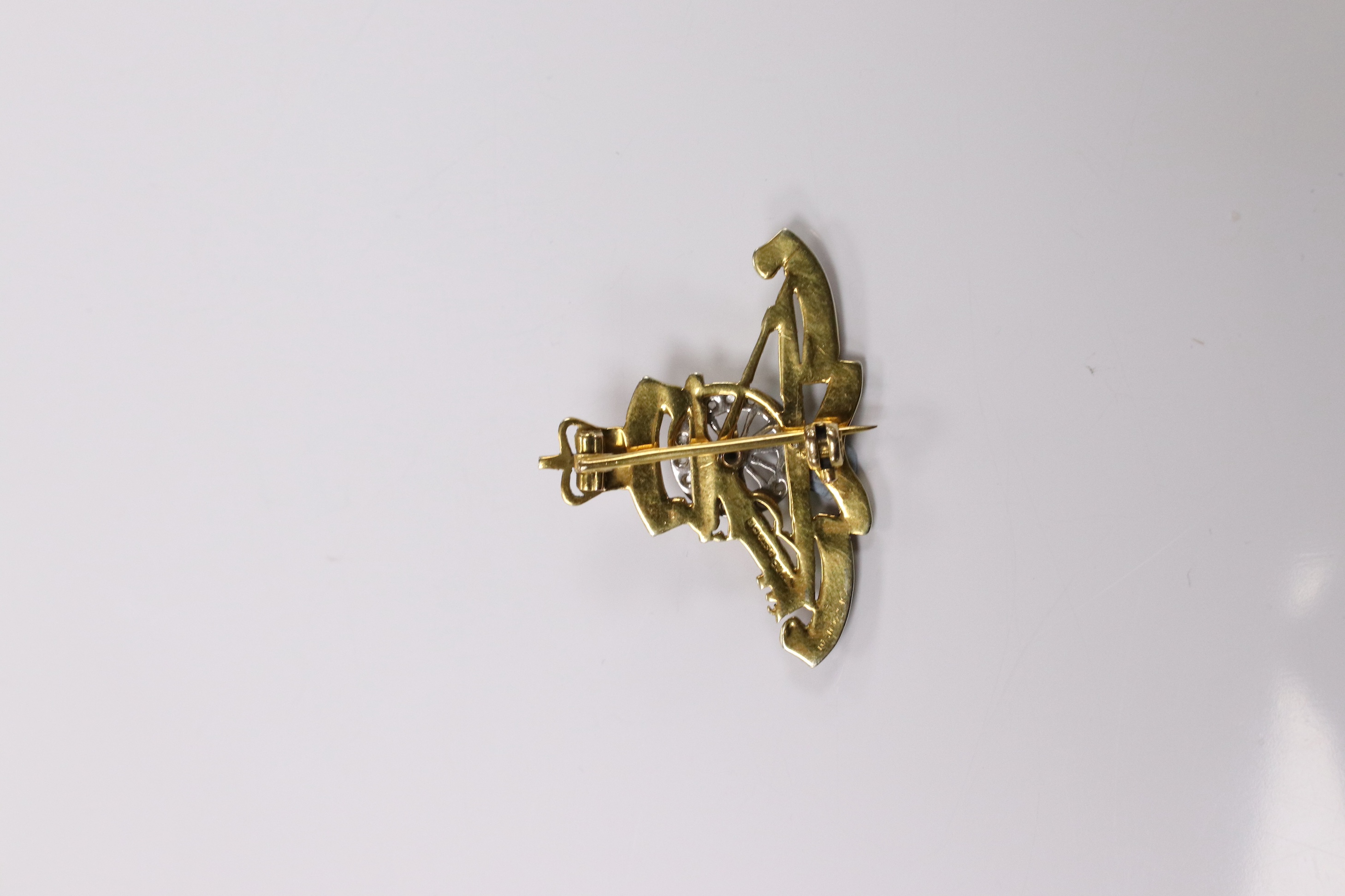 A mid 20th century 9ct gold, diamond and two colour enamel set Royal Artillery sweethearts brooch, 36mm, gross weight 5.7 grams. Condition - poor to fair